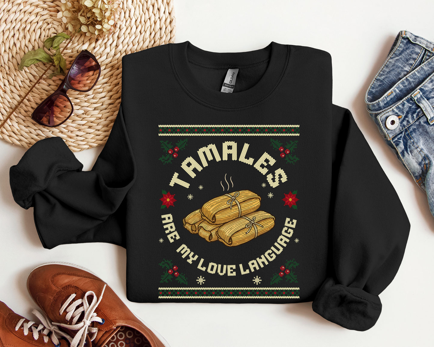 Black crewneck sweatshirt with “Tamales Are My Love Language” Christmas design and steaming tamales illustration.