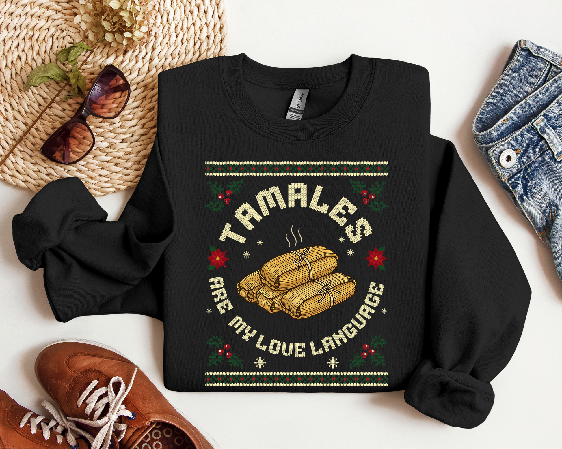 Black crewneck sweatshirt with “Tamales Are My Love Language” Christmas design and steaming tamales illustration.