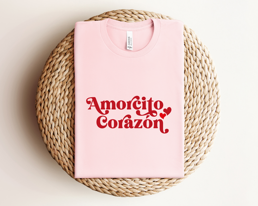 Graphic design of the Amorcito Corazon Latine Tee showing heart motif